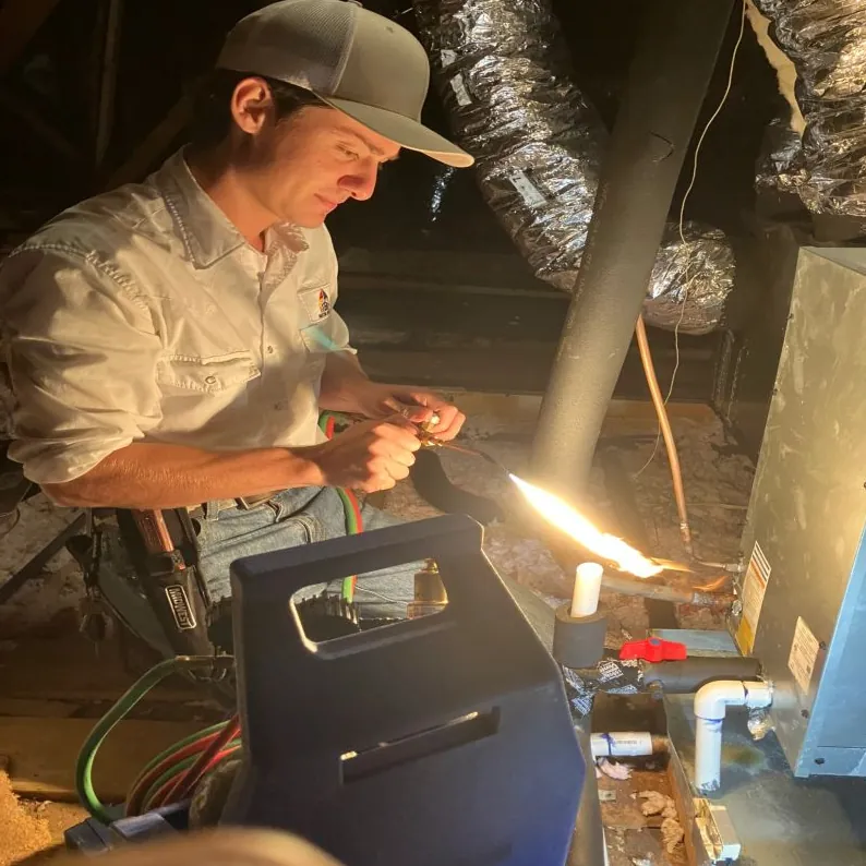 Brazing a copper refrigerant line in an attic